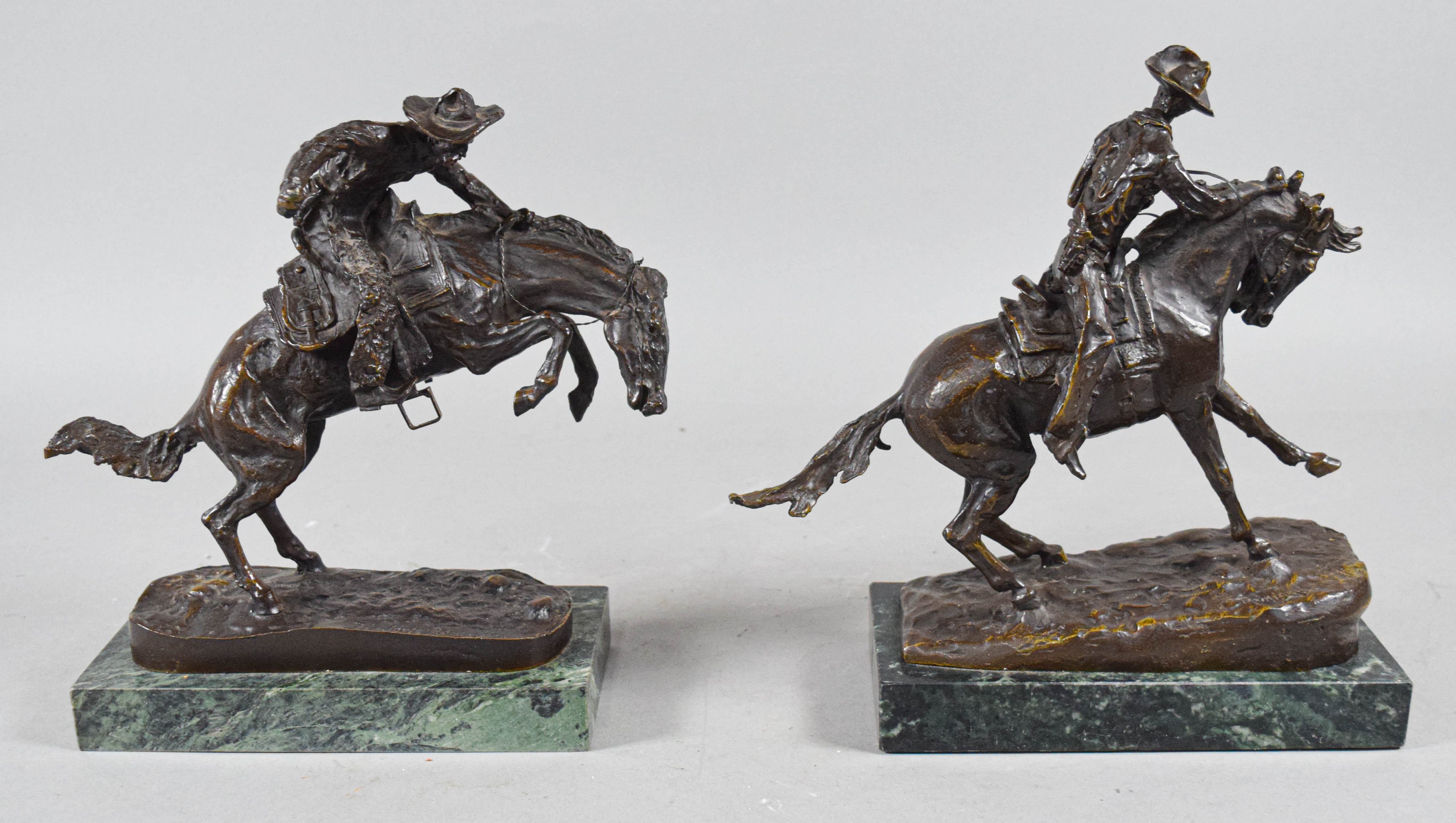 Pair of Frederic Remington Bronze Cowboy Sculptures