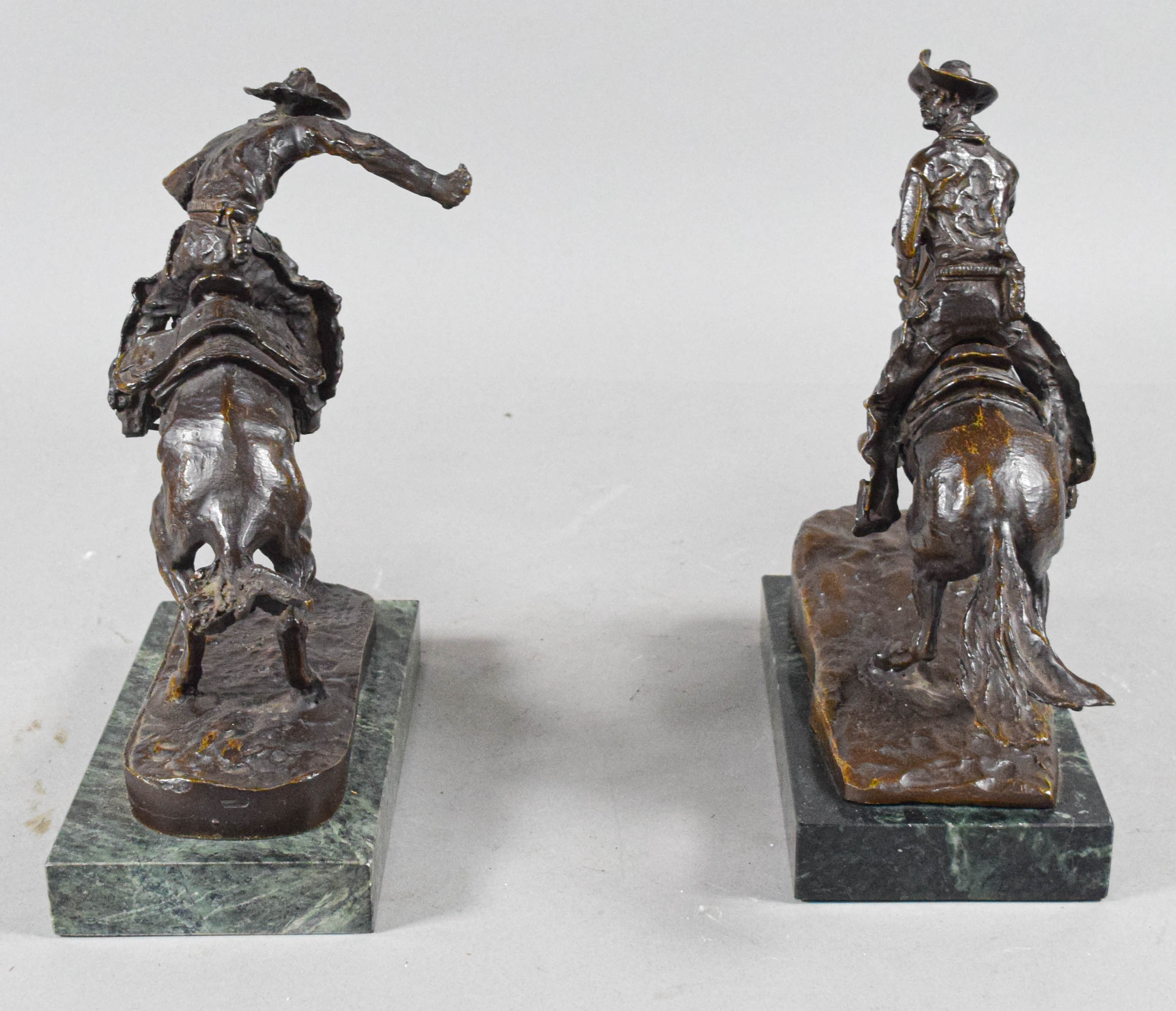 Pair of Frederic Remington Bronze Cowboy Sculptures