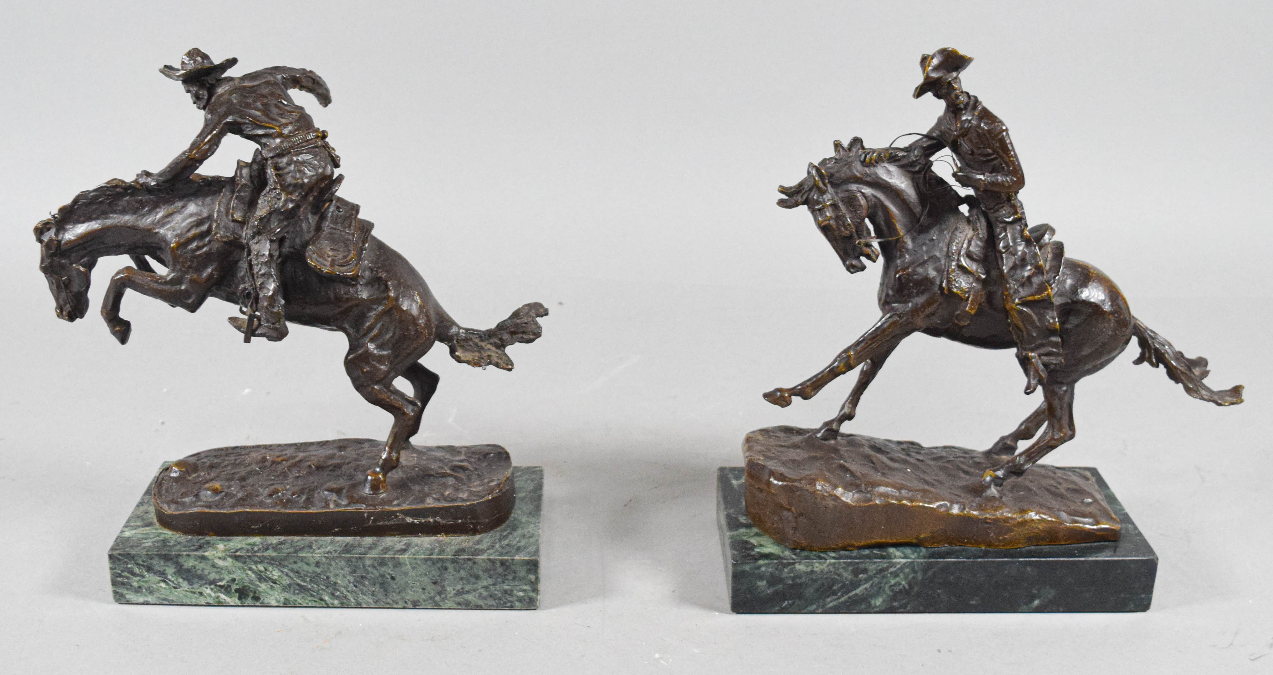 Pair of Frederic Remington Bronze Cowboy Sculptures