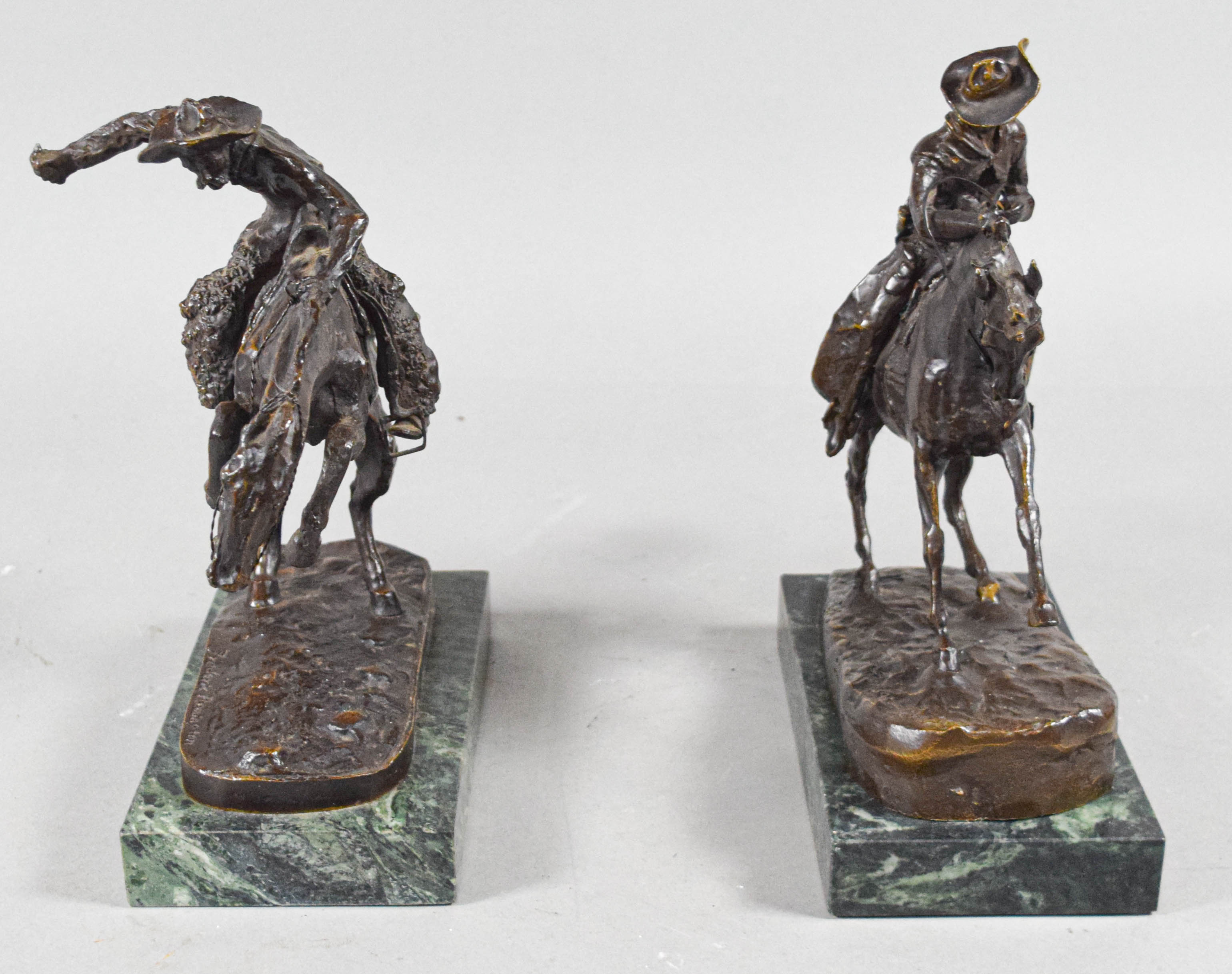 Pair of Frederic Remington Bronze Cowboy Sculptures