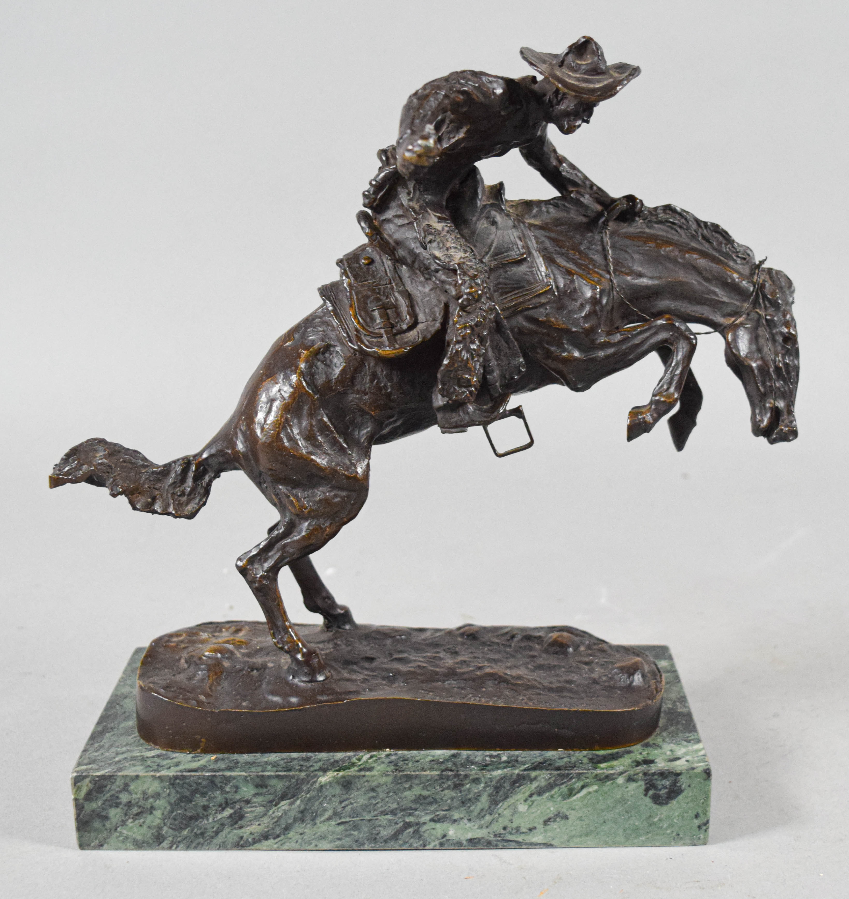 Pair of Frederic Remington Bronze Cowboy Sculptures