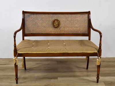 Regency Style Cane Back Settee with Painted Floral Medallions. Regency style settee with an oval 