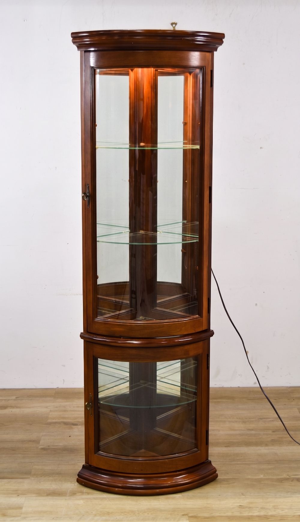 Lot 347: Pulaski Furniture Lighted Corner Curio Cabinet