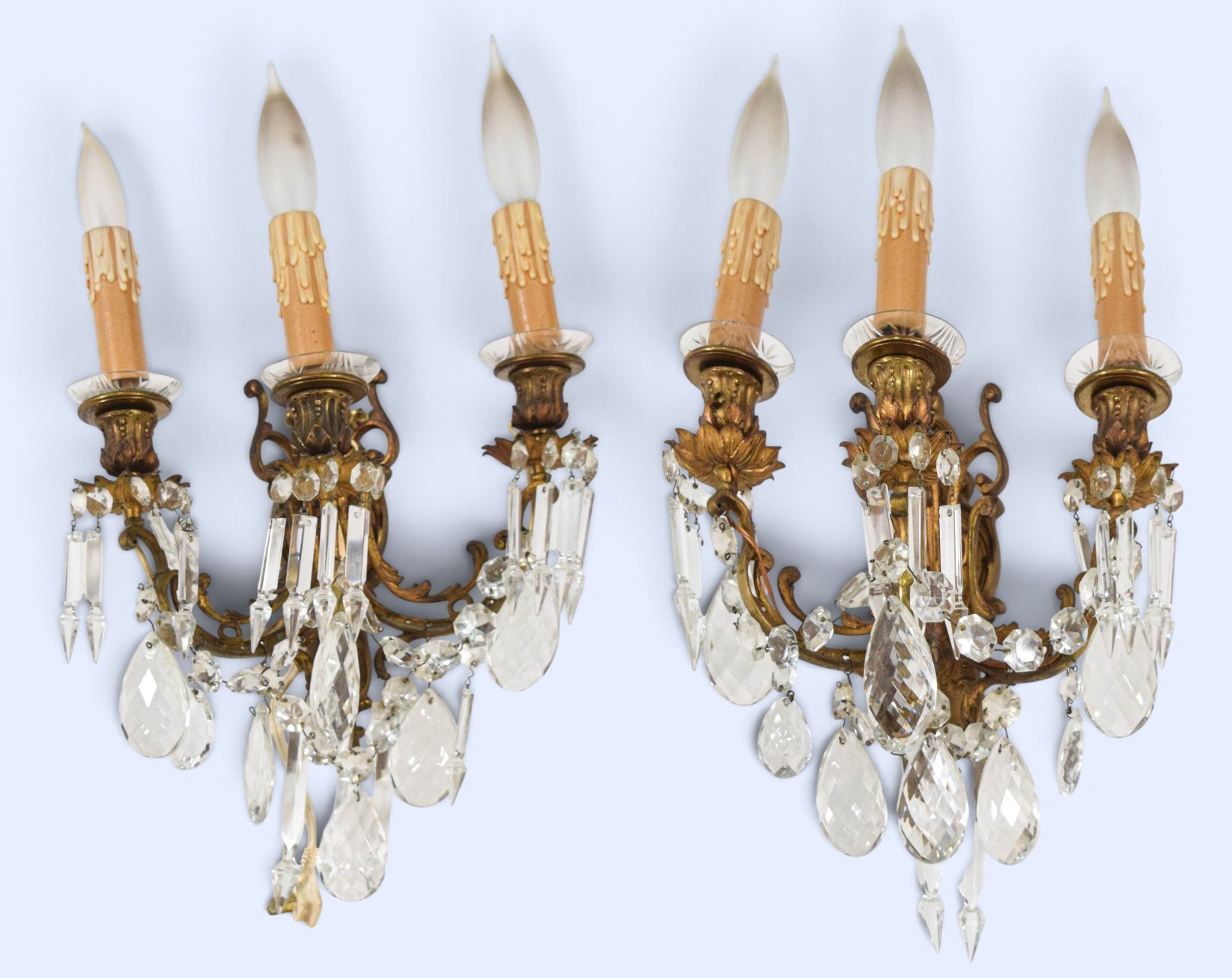 A Pair of French Style Bronze and Crystal Three-Light Wall Sconces