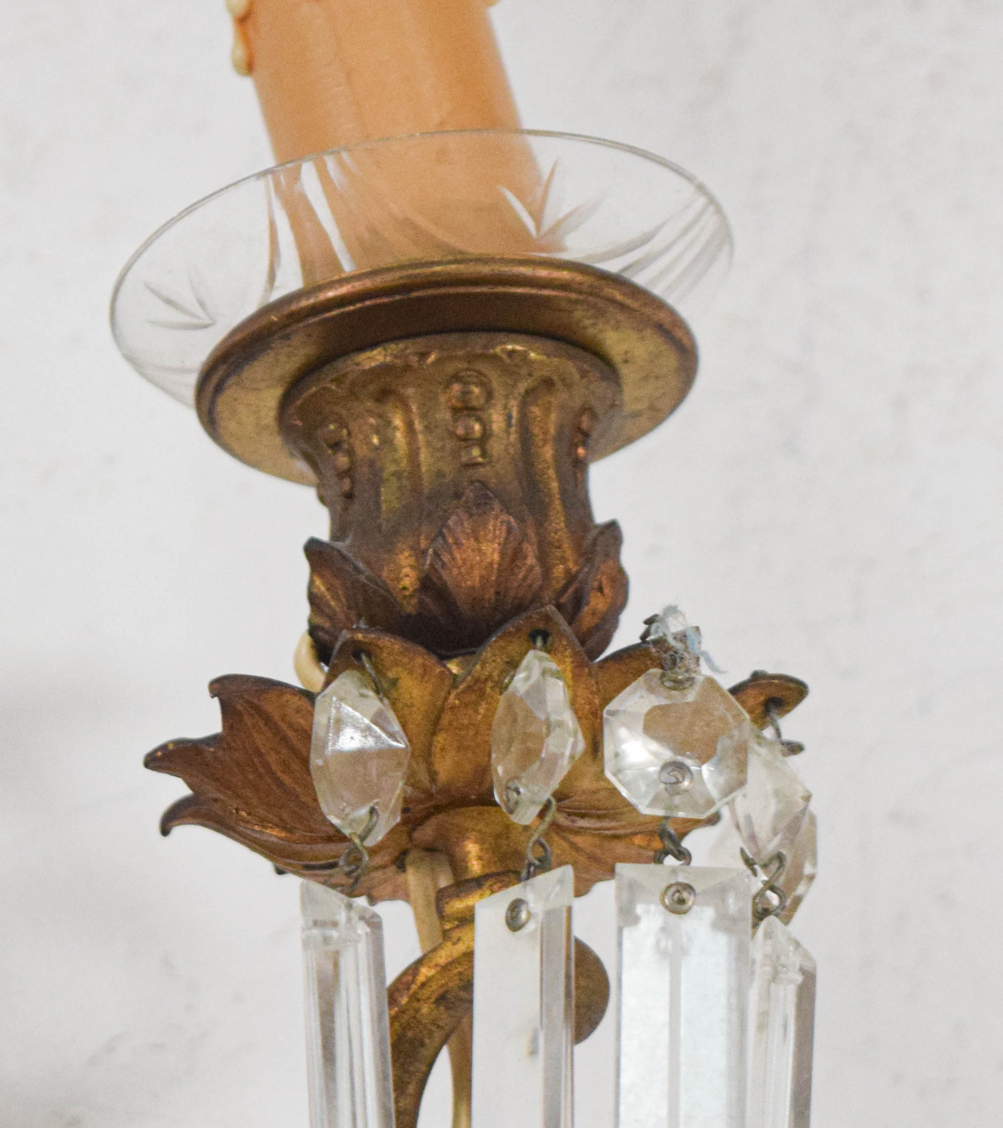 A Pair of French Style Bronze and Crystal Three-Light Wall Sconces