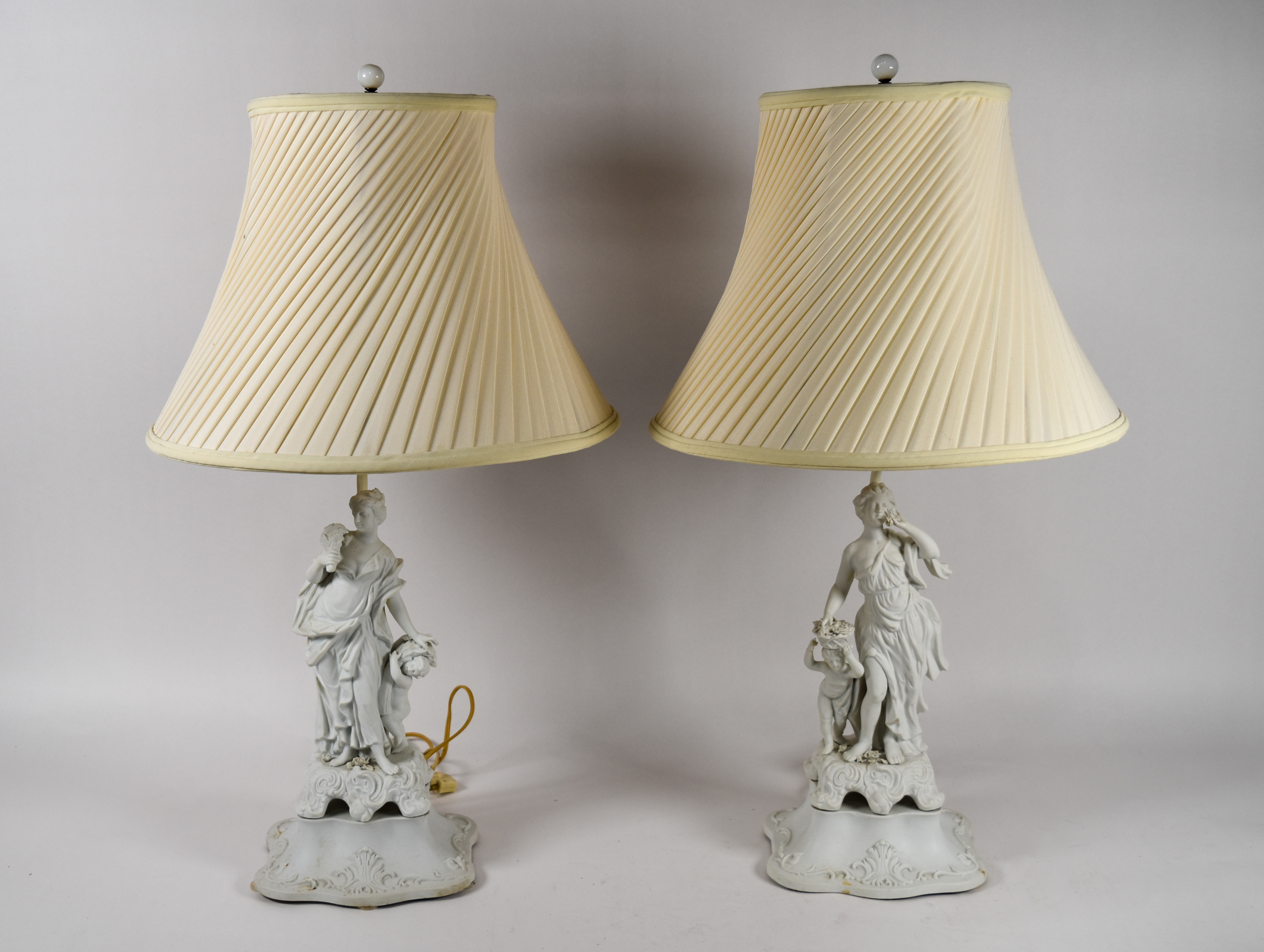 A Pair of Andrea by Sadek Neoclassical Bisque Porcelain Figural Table Lamps