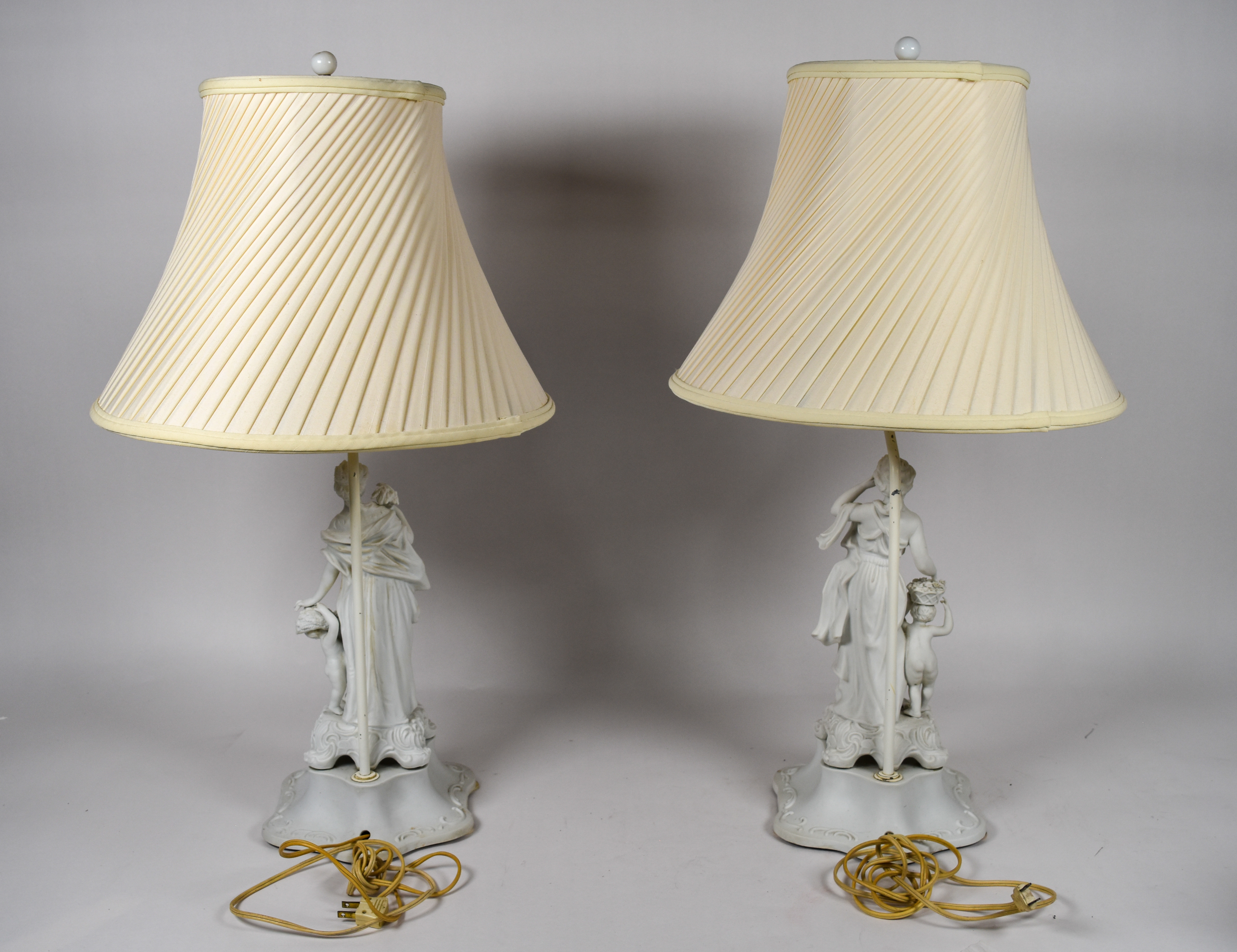A Pair of Andrea by Sadek Neoclassical Bisque Porcelain Figural Table Lamps