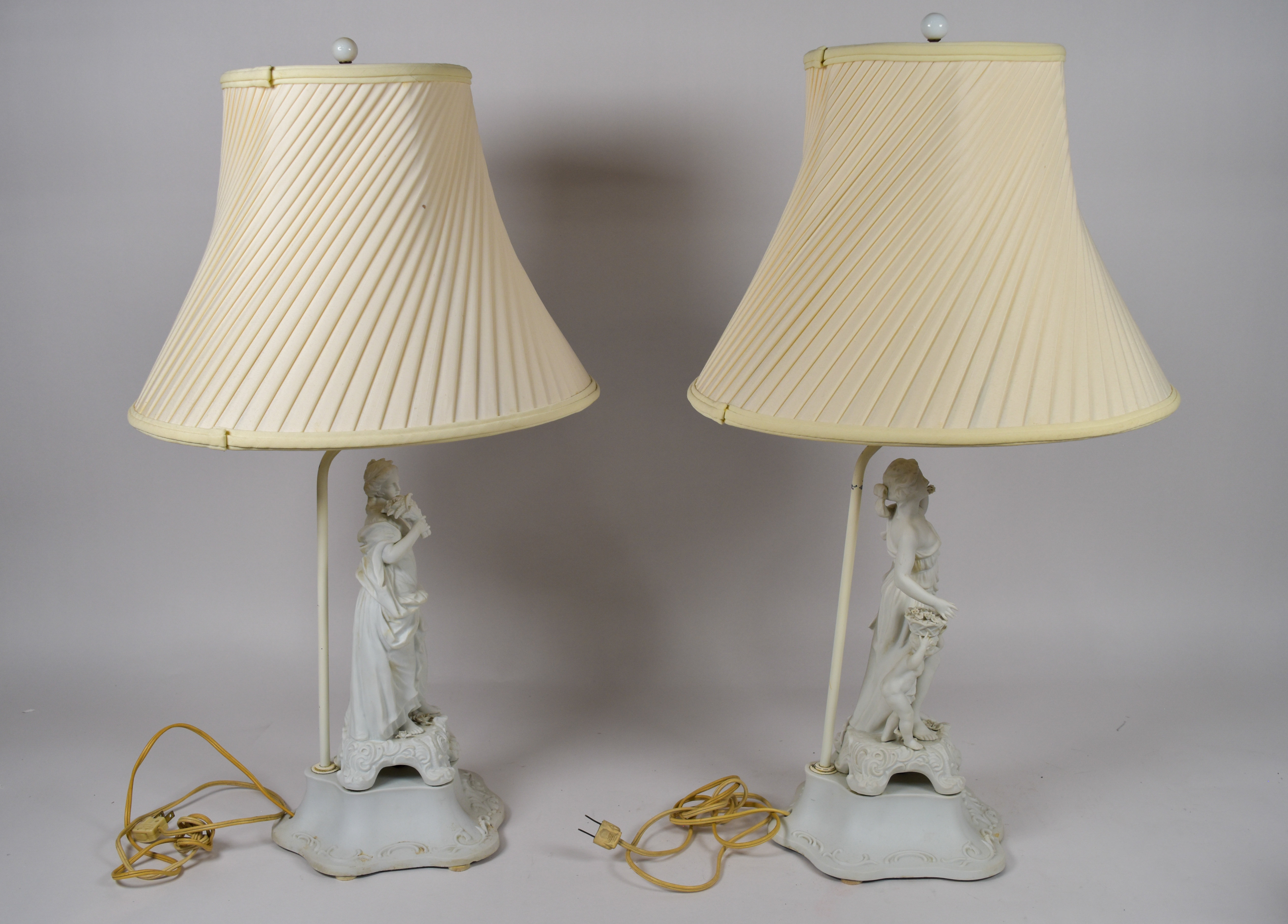 A Pair of Andrea by Sadek Neoclassical Bisque Porcelain Figural Table Lamps