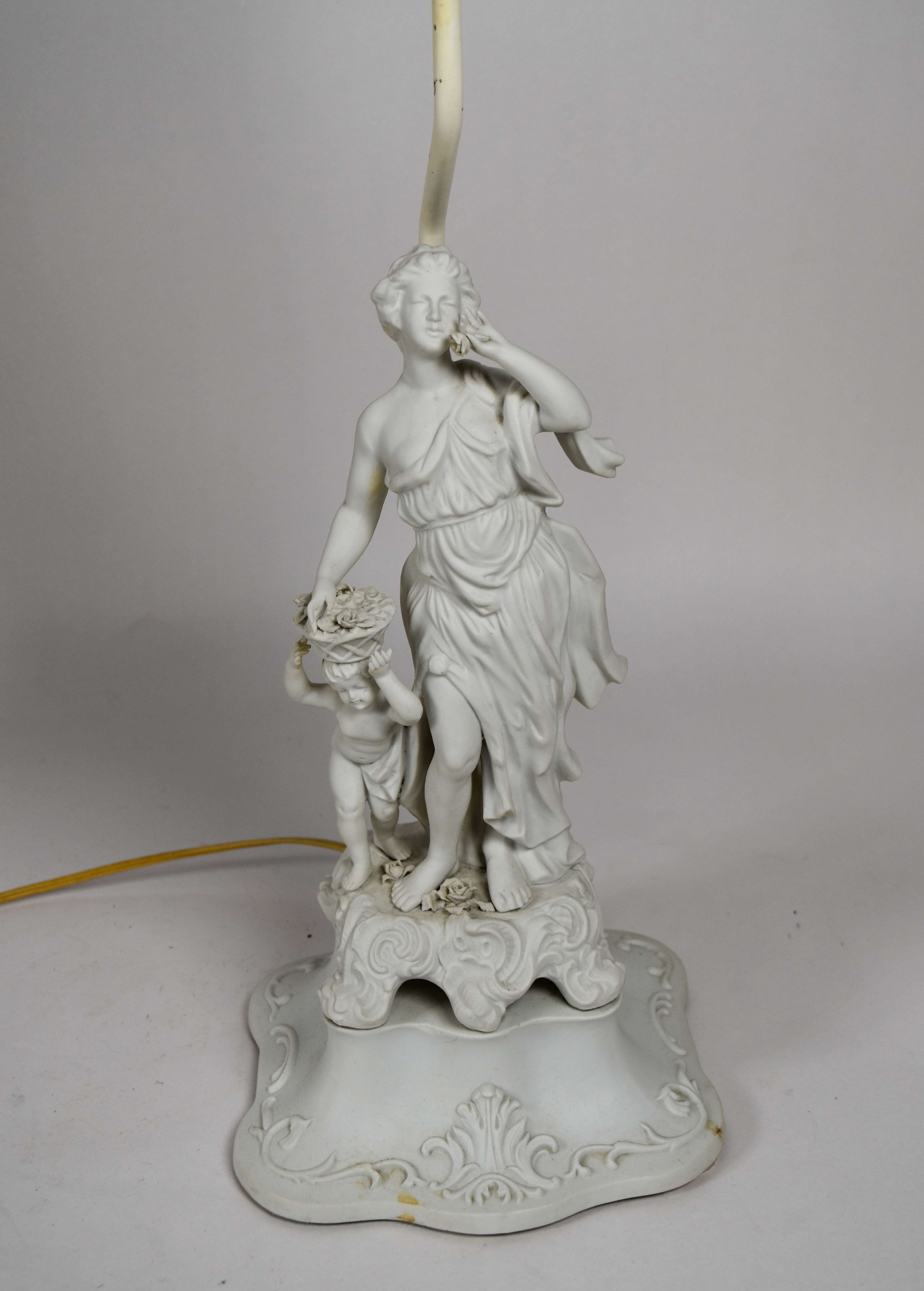 A Pair of Andrea by Sadek Neoclassical Bisque Porcelain Figural Table Lamps