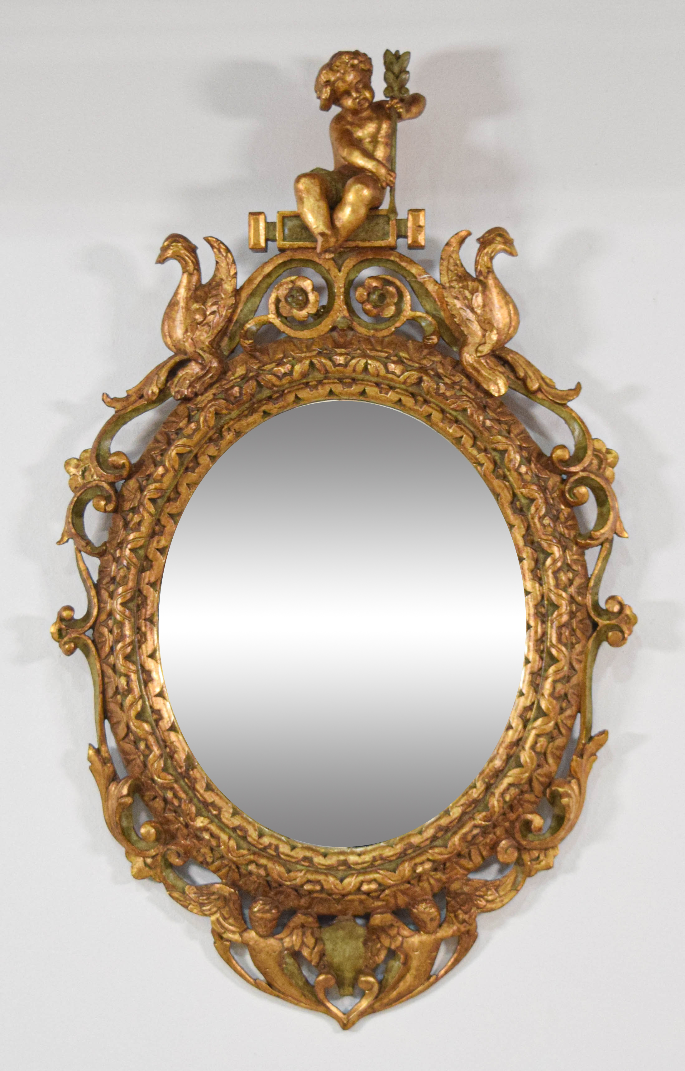 Rococo Revival Carved Giltwood Oval Wall Mirror with Cherubs and Birds