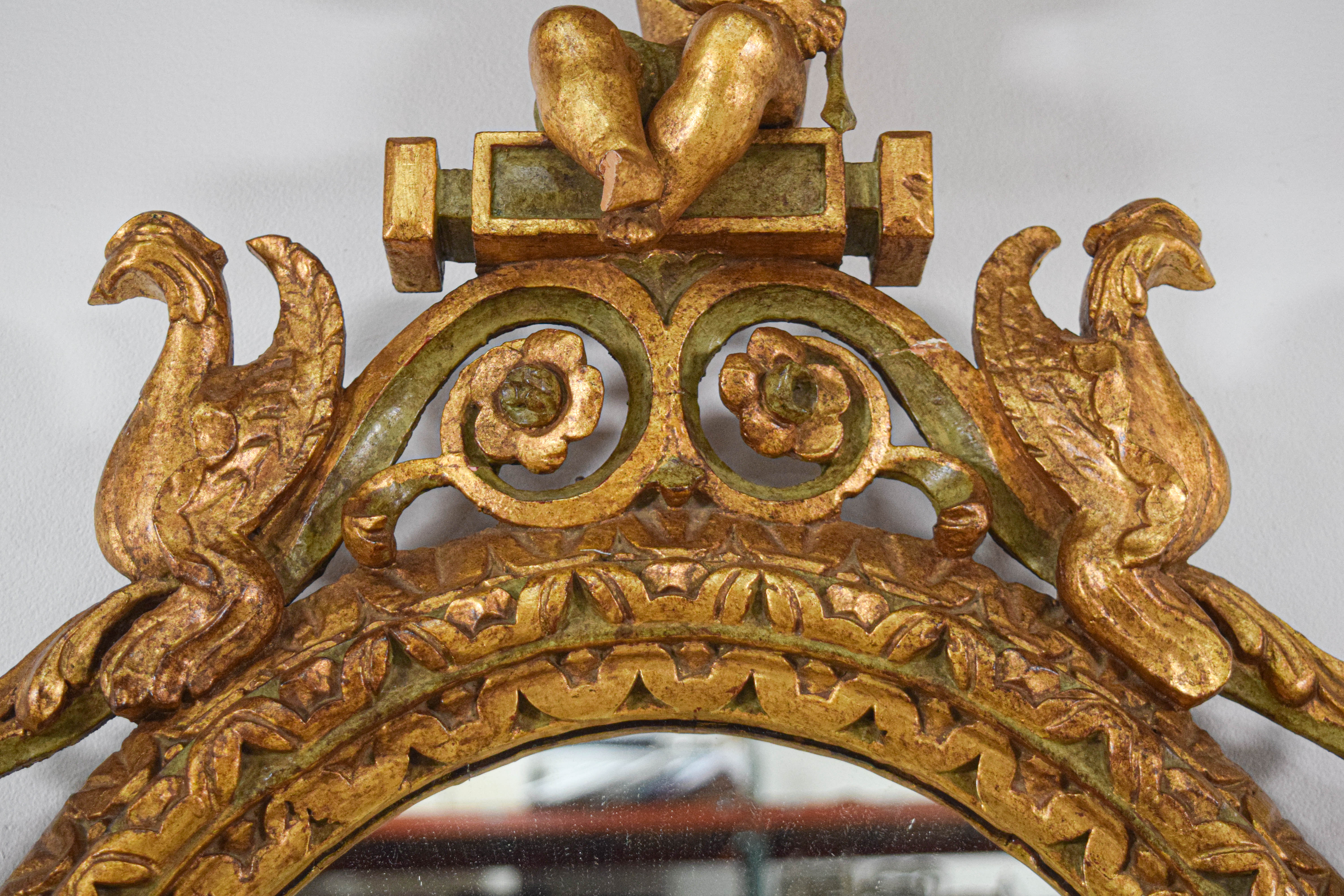 Rococo Revival Carved Giltwood Oval Wall Mirror with Cherubs and Birds