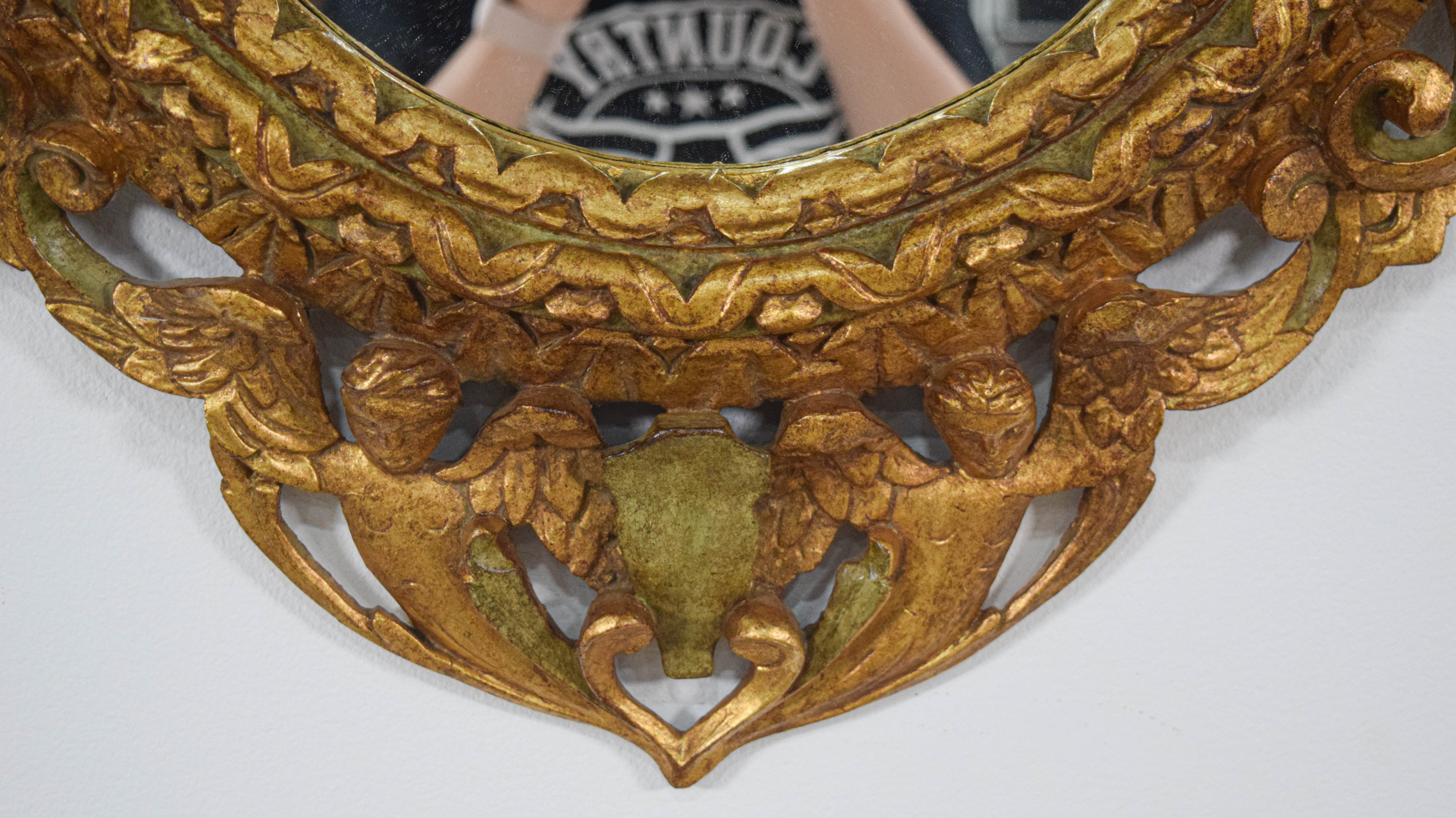 Rococo Revival Carved Giltwood Oval Wall Mirror with Cherubs and Birds