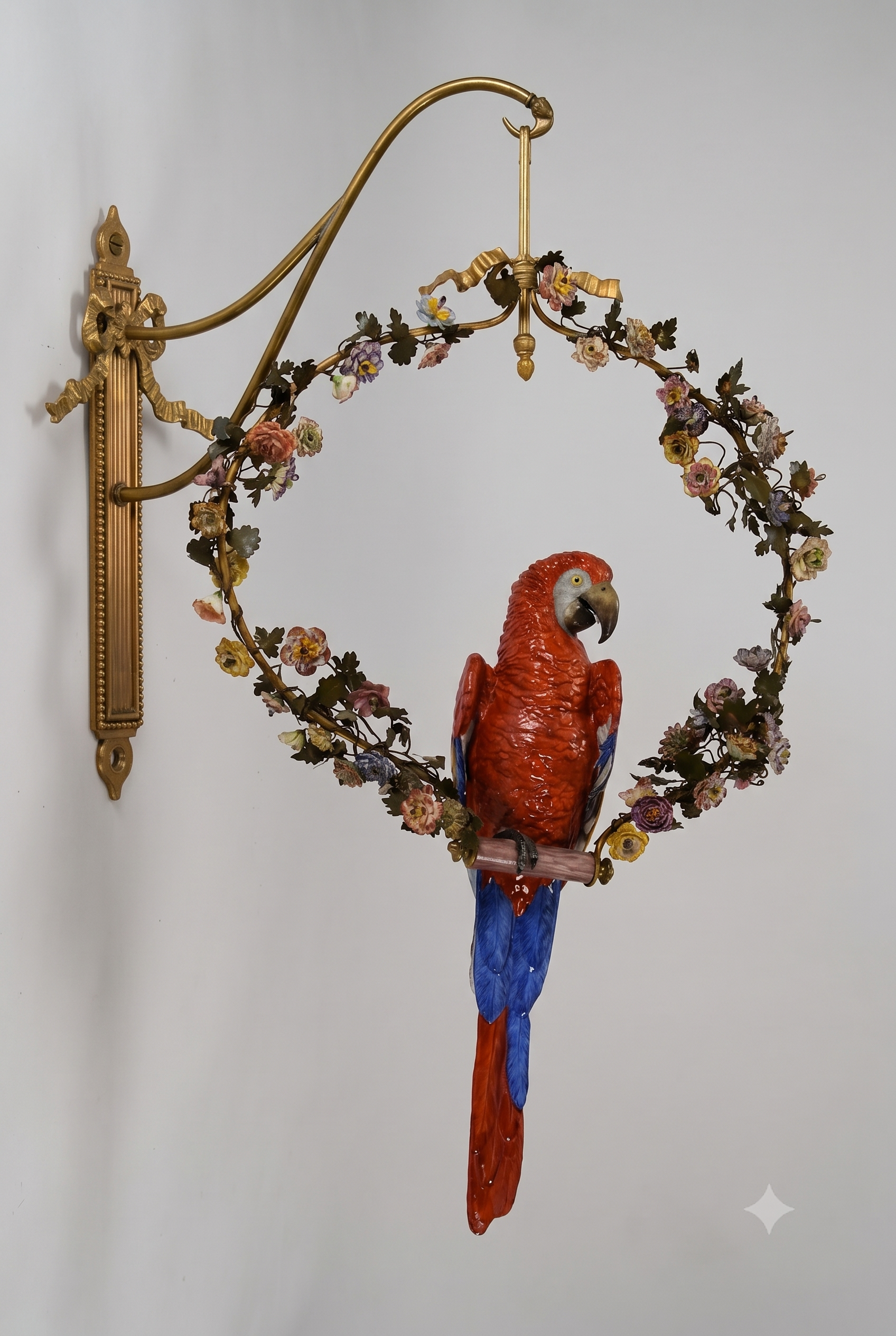Large Porcelain Scarlet Macaw Within A Floral Wreath and Gilt Wall Bracket