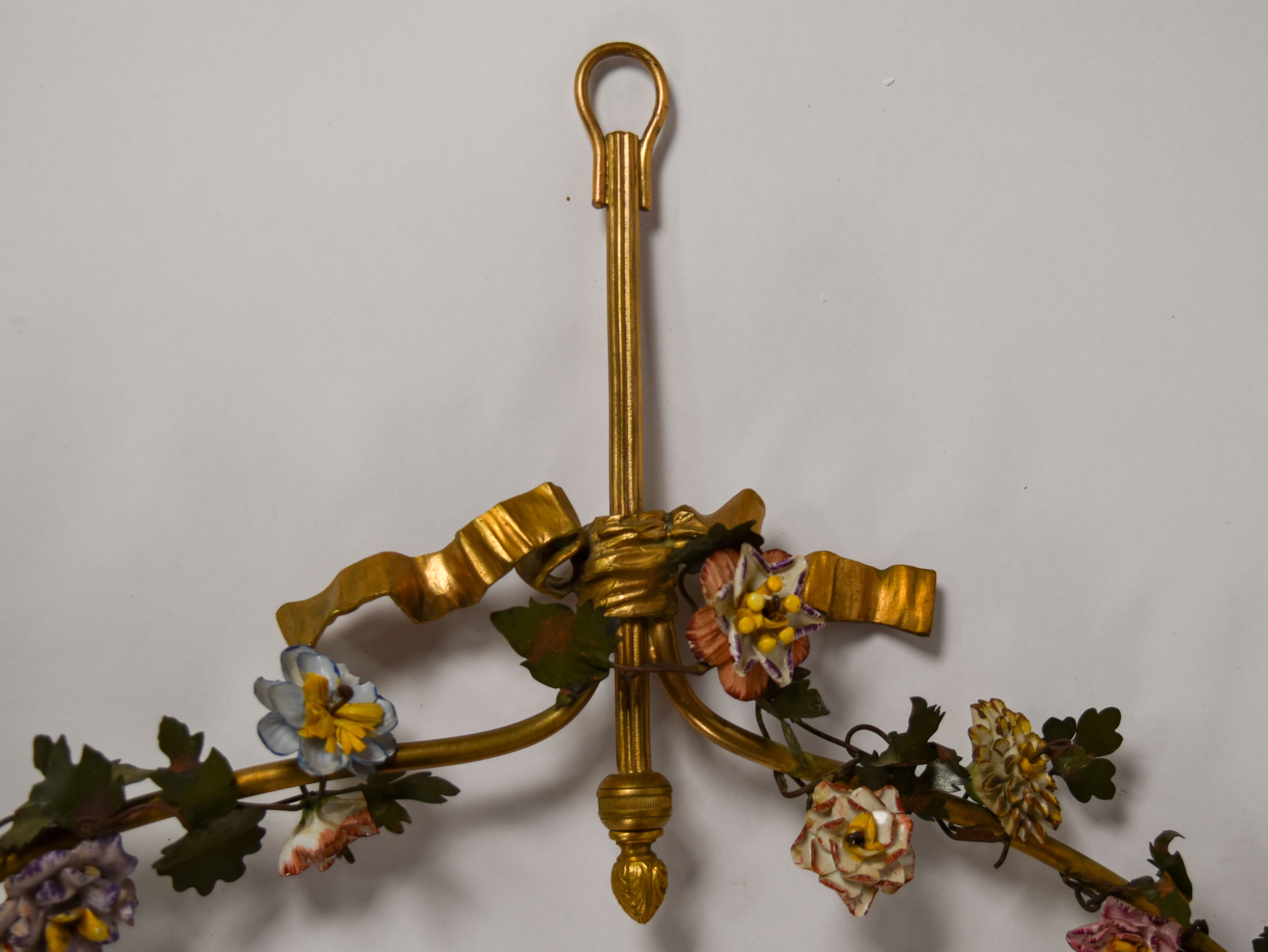 Large Porcelain Scarlet Macaw Within A Floral Wreath and Gilt Wall Bracket