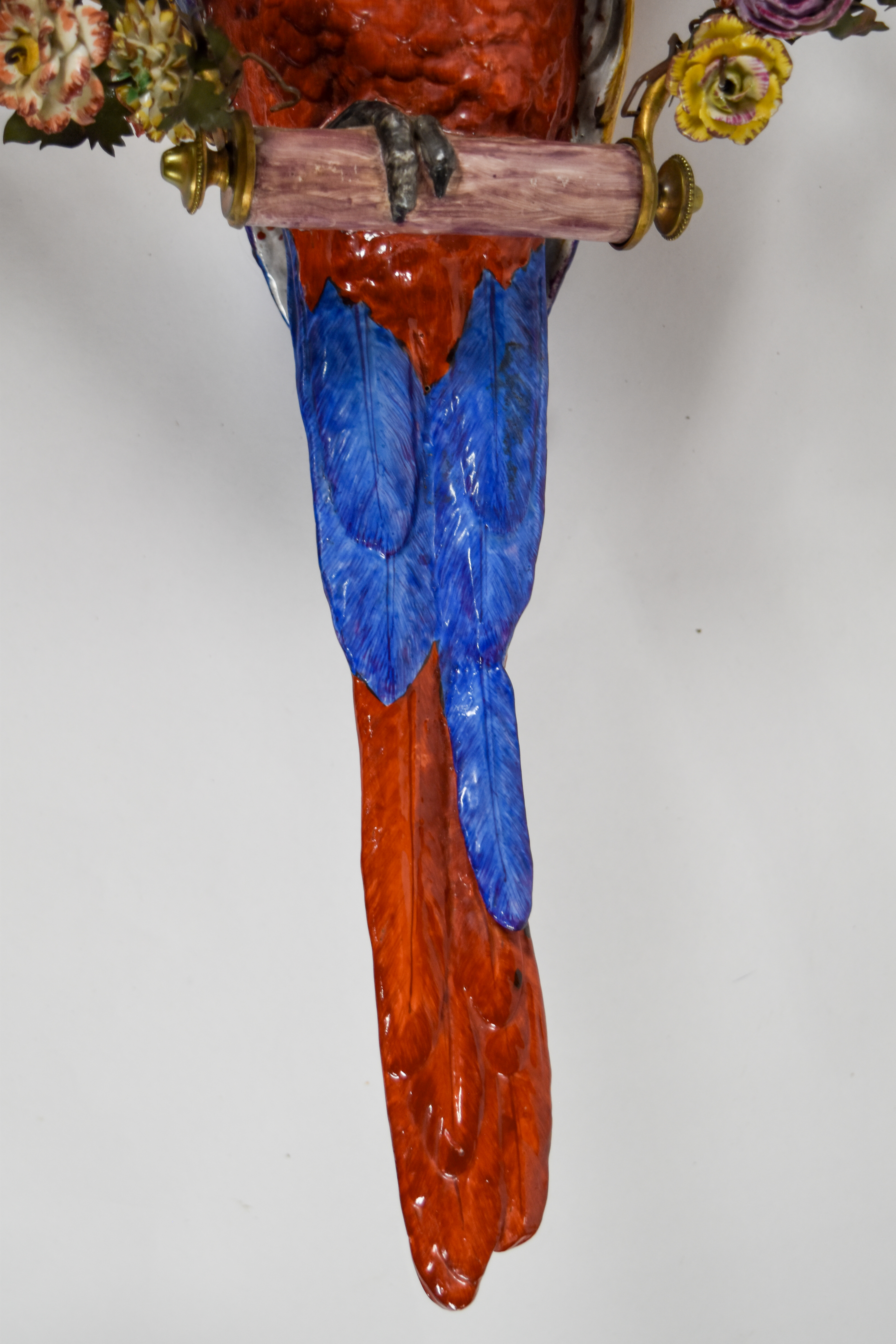Large Porcelain Scarlet Macaw Within A Floral Wreath and Gilt Wall Bracket