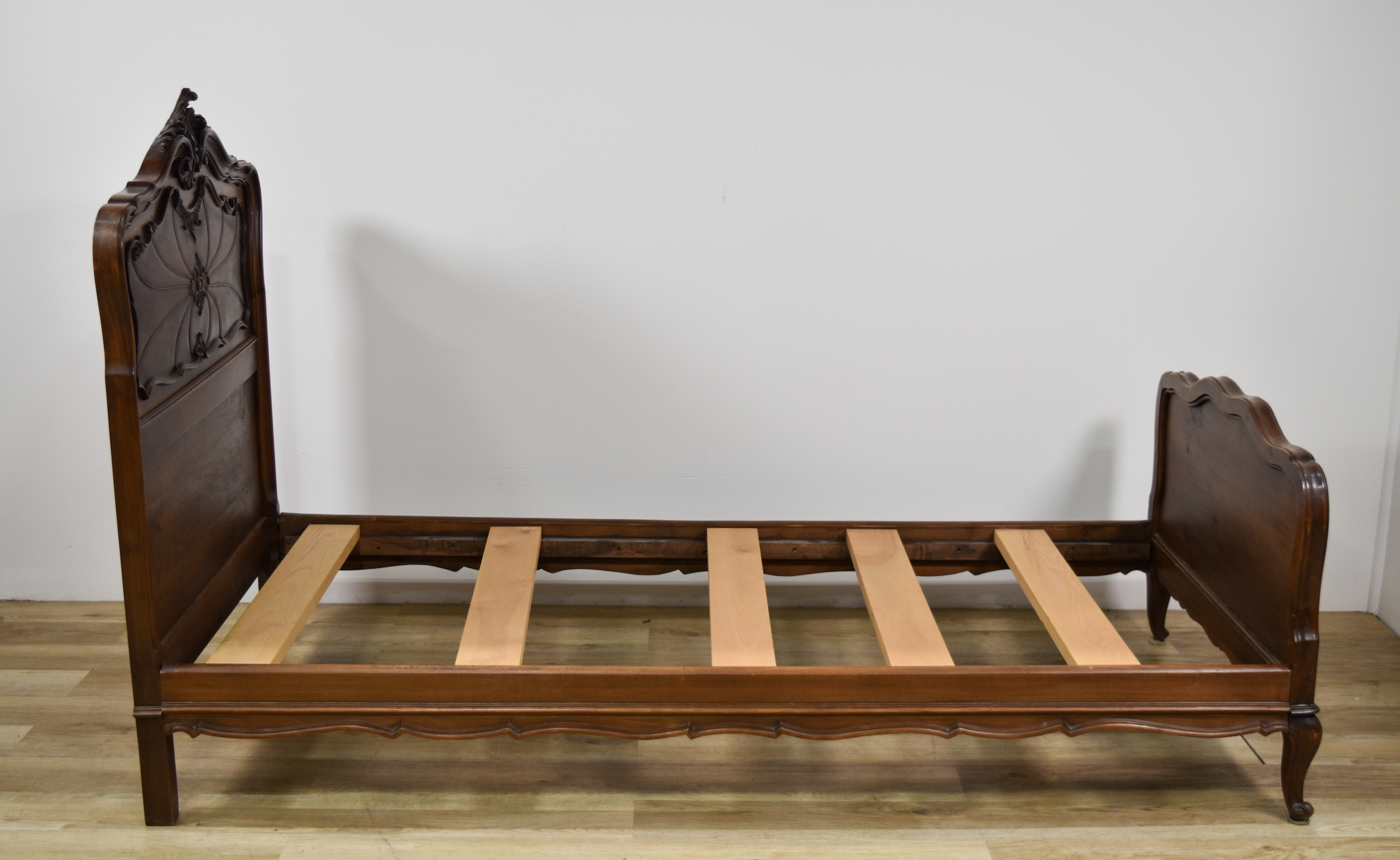 A Near Pair of Louis XV Style Twin Wood Bed Frames