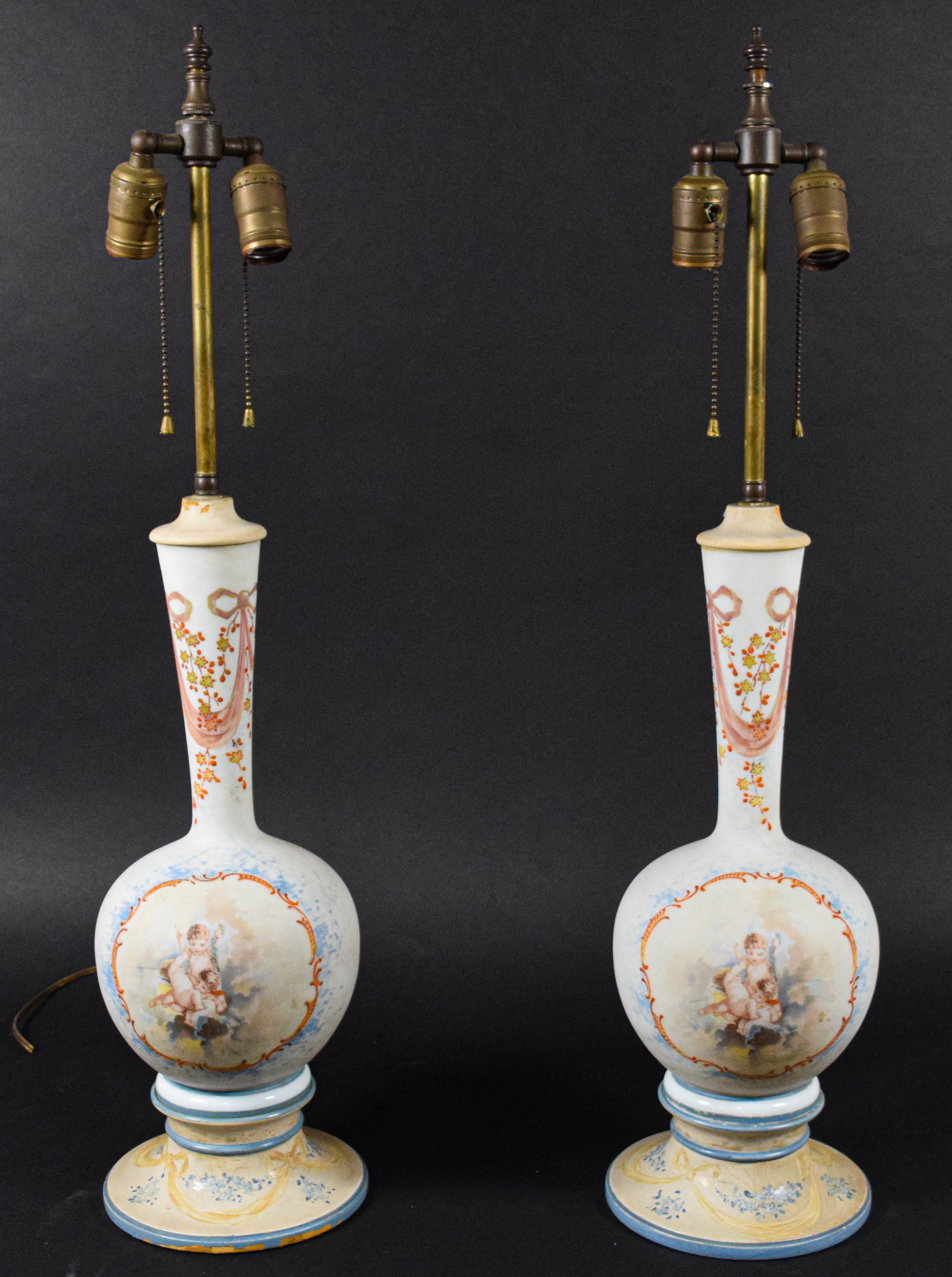 A Pair of Neoclassical Style Porcelain Vase Form Table Lamps with Cherub Decoration