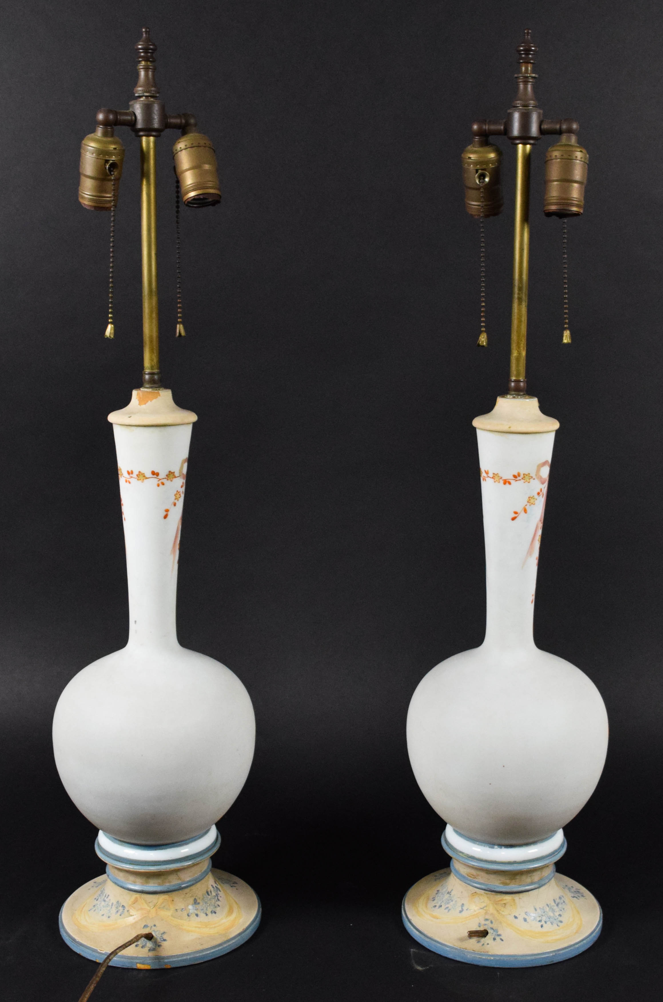 A Pair of Neoclassical Style Porcelain Vase Form Table Lamps with Cherub Decoration