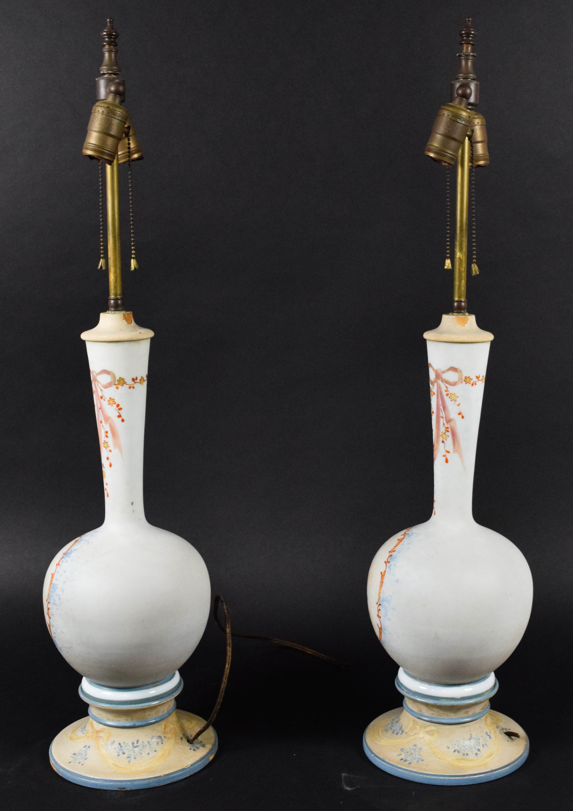 A Pair of Neoclassical Style Porcelain Vase Form Table Lamps with Cherub Decoration