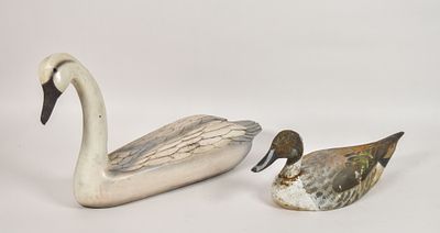 2 Painted Wood Bird Decoys. Two hand-carved and painted wooden bird decoys, comprising a swan 
