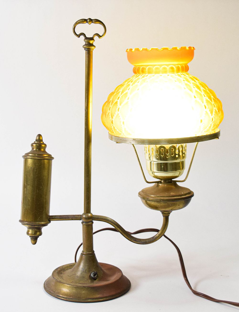 Lot 272: Victorian Style Brass Student Lamp with Quilted Amber Glass Shade