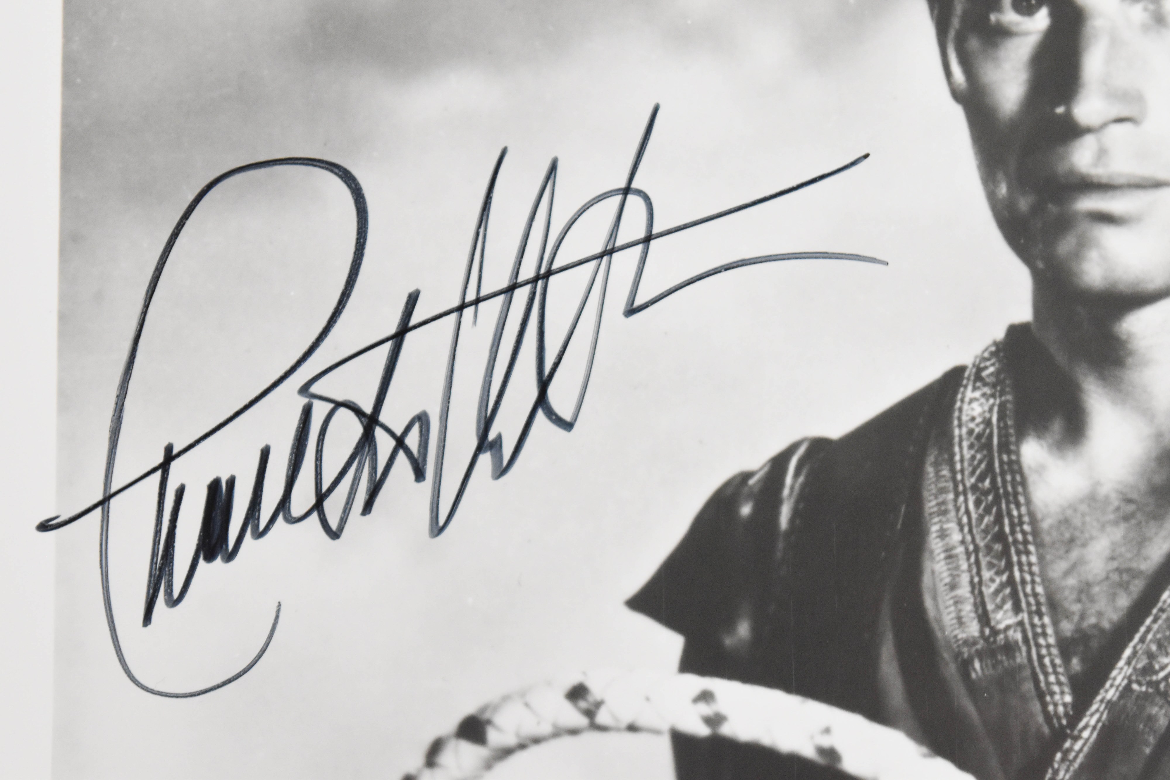 2 Charlton Heston Autographed Black and White Photographs