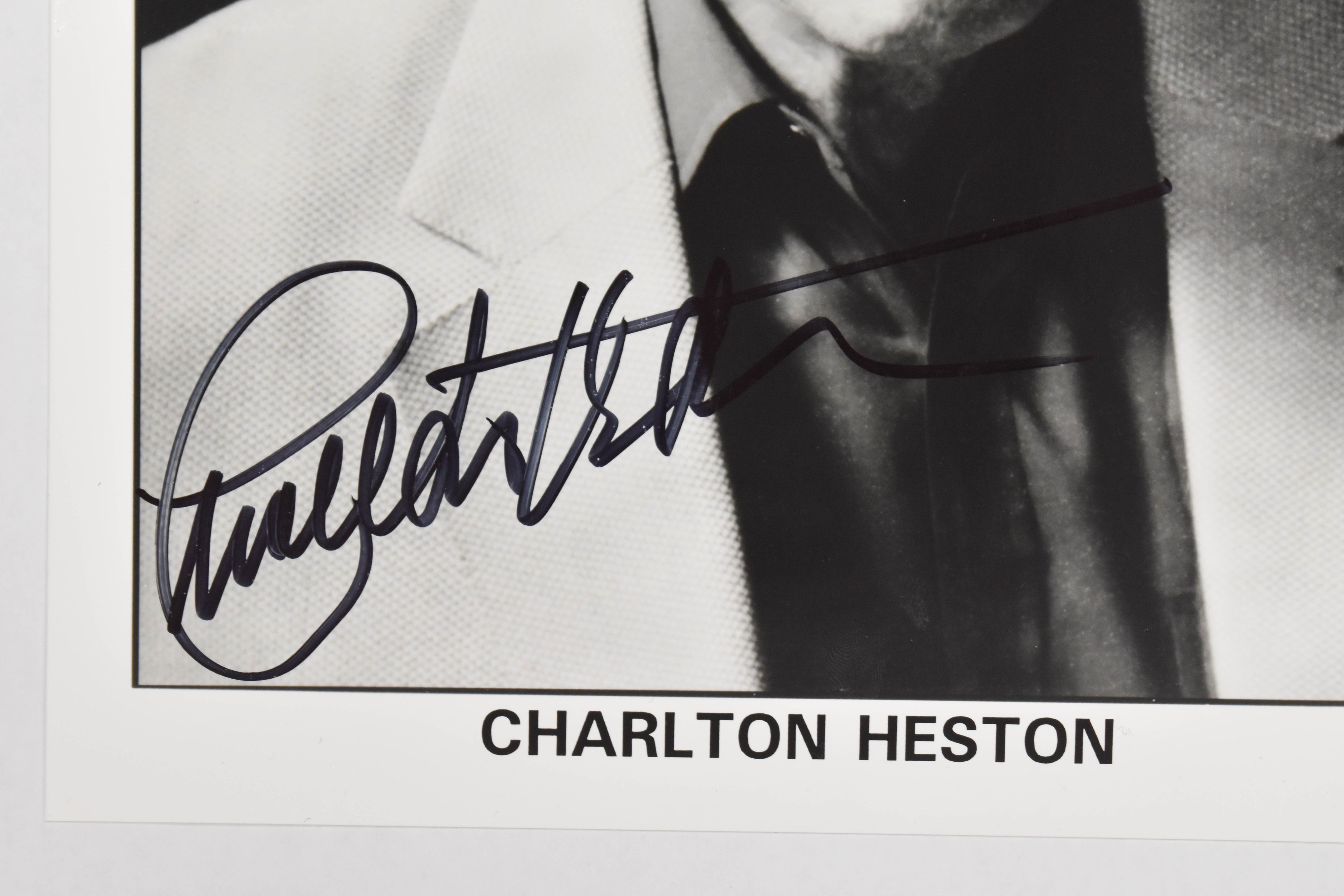 2 Charlton Heston Autographed Black and White Photographs