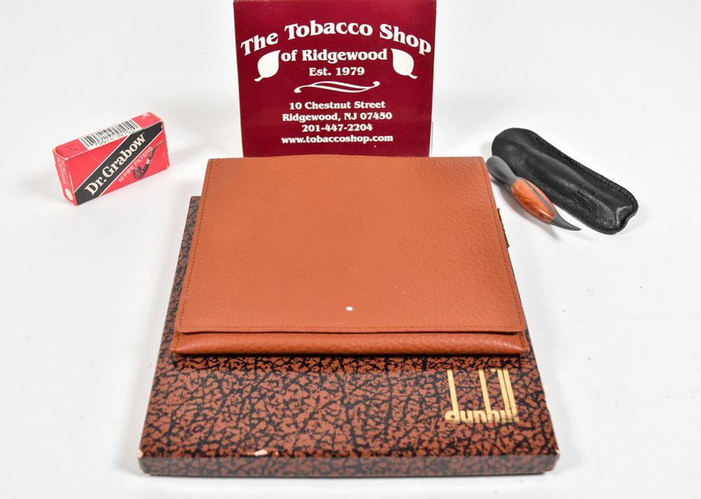 Lot 254: Dunhill Leather Tobacco Pouch and Castello Sterling Silver Pipe Tamper Assortment