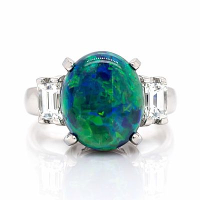 Platinum 3.53 Ct. Opal & Diamond Ring. Platinum ring featuring a vivid 3.53 ct opal (stamped 