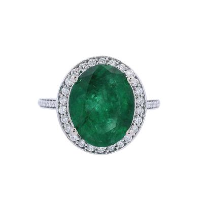 14kt white Gold Halo Ring with 4.35 CTW in Emerald & Diamonds. Halo ring crafted from 14kt white 
