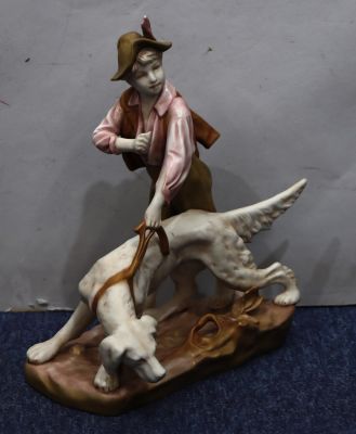 A Royal Dux group of young boy and dog, 33cm high