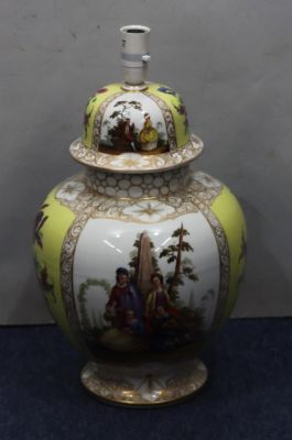A Dresden round bulbous lidded ginger jar on white and yellow ground with multicoloured figure 