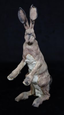 A Studio glazed earthenware figure of a standing hare with embossed monogram, 33.5cm high
