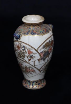 A Meiji period round bulbous thin neck vase on cream ground with multicoloured floral, leaf and 