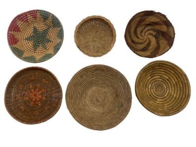 A group of six handwoven tribal baskets. A group of six handwoven tribal decorative baskets. 