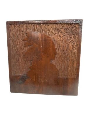 A hand carved American Indian profile wood plaque. A unique wood hand carved silhouette of an 