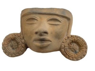 A Terracotta Clay Aztec Mexican Mayan decorative face. A Terracotta Clay Aztec Mexican Mayan 