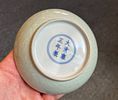 A FINE CHINESE INCISED CELADON-GLAZED DISH, YONGZHENG MARKS 
12 CM DIAMETER 
2.5 CM HIGH 
GOOD Image - 1