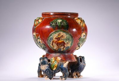TANG SANCAI INLAID AUSPICIOUS BEAST PATTERN BEAST FOOT JARS. Name TANG SANCAI INLAID AUSPICIOUS 
