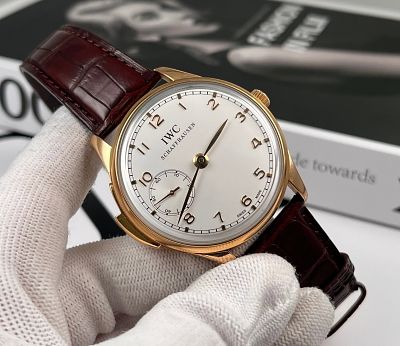 IWC PORTUGUESE 8K ROSE GOLD CASE. 43MM 18K ROSE GOLD CASE, WHITE RHODIUM-PLATED DIAL, MANUAL 
