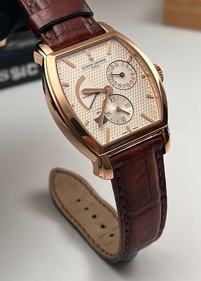 VACHERON CONSTANTIN 8K ROSE GOLD WATCH. 36X48MM CASE DIAMETER, SILVER-TONED BARREL-SHAPED DIAL 