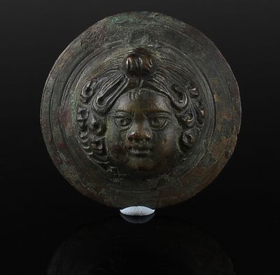 Roman tondo / roundel with Eros head. ITEM: Tondo / Roundel with Eros head MATERIAL: Bronze 