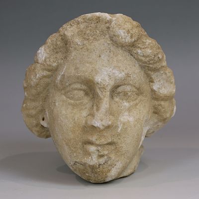 Late Hellenistic / Early Roman head of a woman with tainia. ITEM: Head of a woman with tainia 