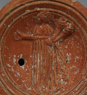 Roman oil lamp depicting Ceres holding two cornucopias, Type Loeschcke I. ITEM: Oil lamp 