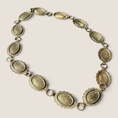 Stamped Metal Concho Belt. Measuring approx 32 inches in length.We offer effecient &amp; 