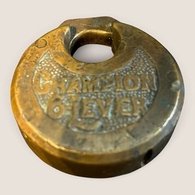 Champion 6-Lever Brass Pancake Padlock. This round brass pancake or pie-style padlock features a 