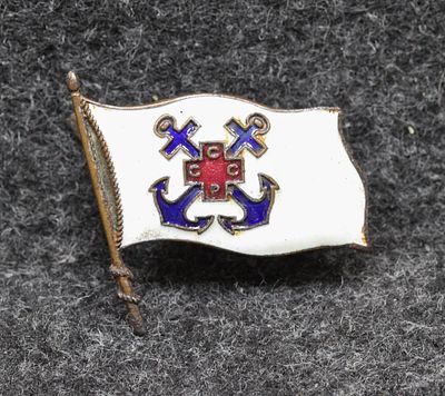 Кокарда ОСВОД 30-е годы. Сталь, эмаль, размер 27,7 (по древку знамени) на 31 мм. Кокарда в 